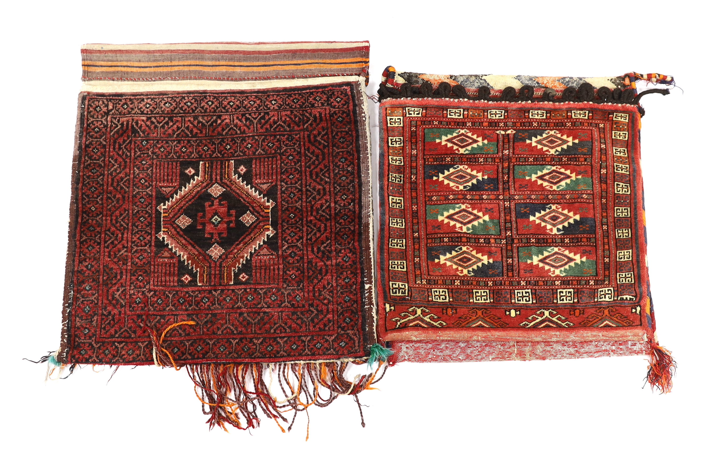 Two late 19th / early 20th century Caucasian saddle bags, largest 132cm long x 59cm wide